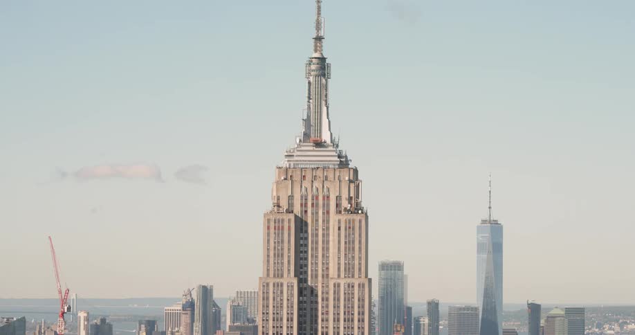 A tall building covers the skyline