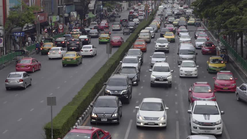 The cars are packed on the street moving very slowly