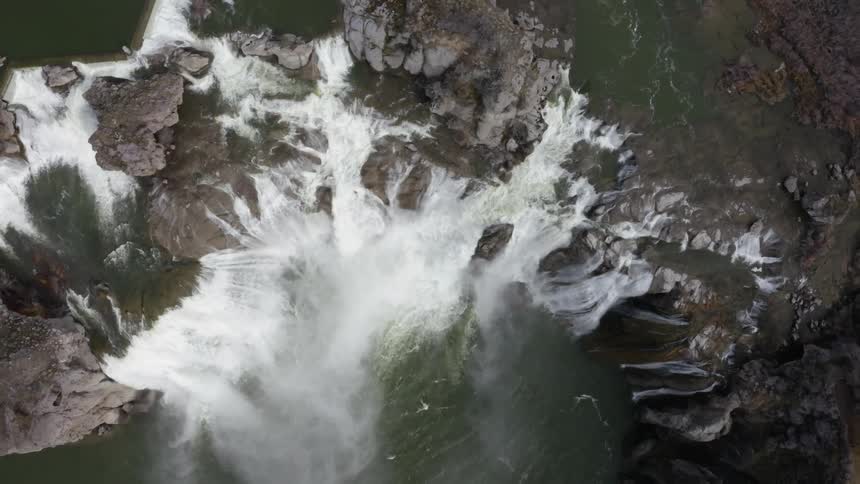 Waterfalls flow over a cliff