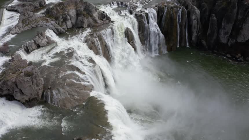 Waterfalls flow over a cliff