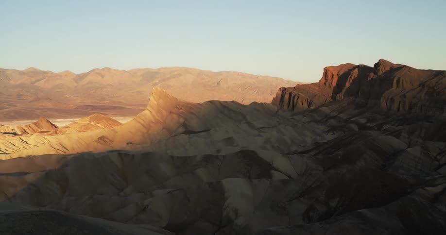 The sun rises over zabriskie point