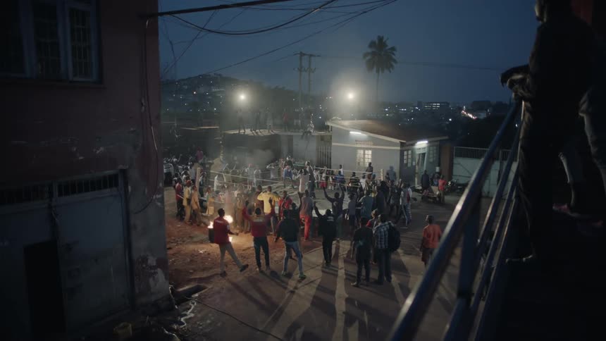 Group of people partying outside in the city at night