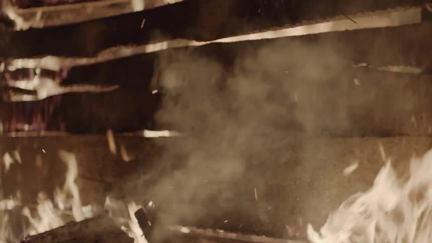 A fire burns a house
