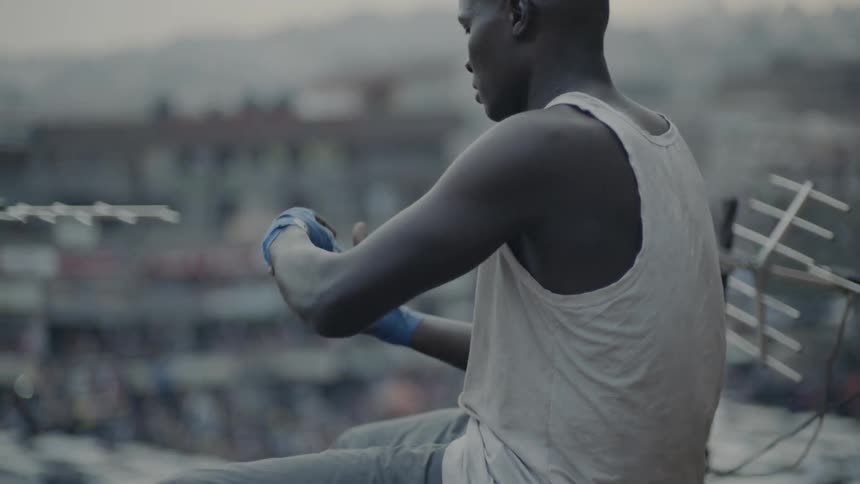 Man wraps his hands in athletic tape