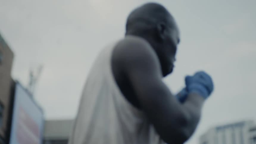 Man practices boxing moves