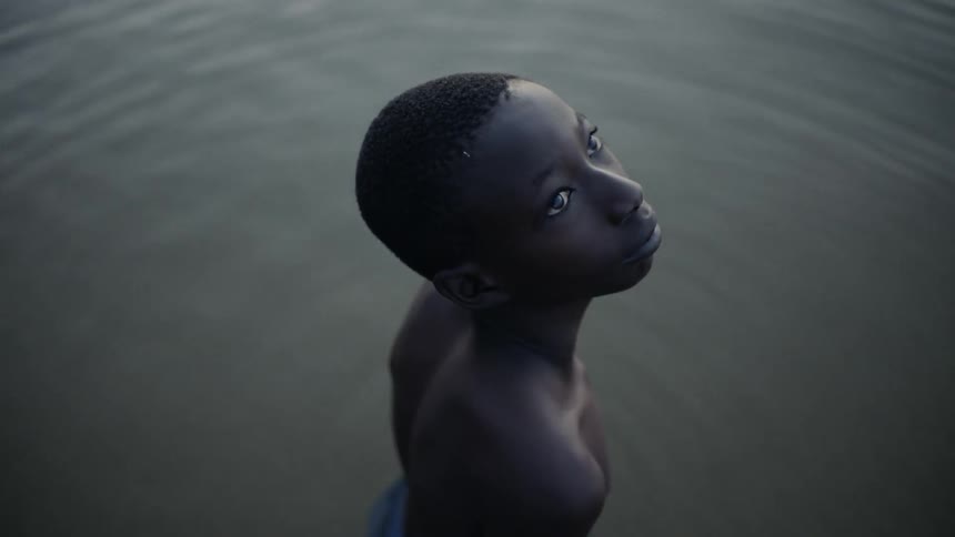 Person stands in a pool of flowing water