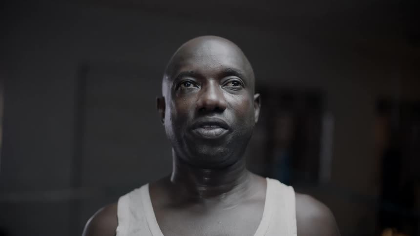 Man talks and blinks one eye