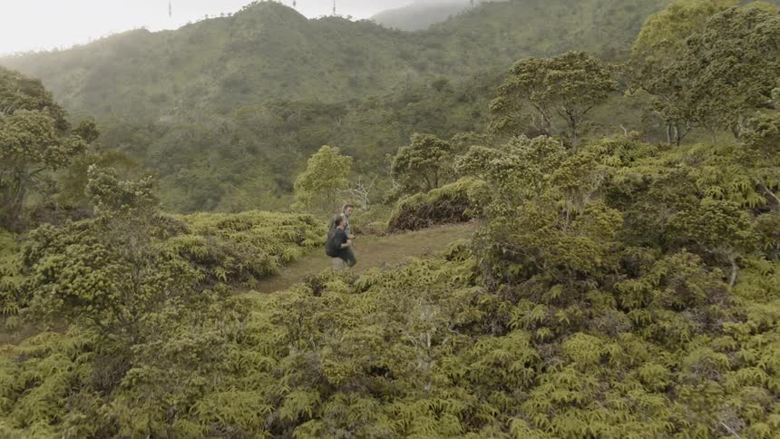 Two men hike in mountains