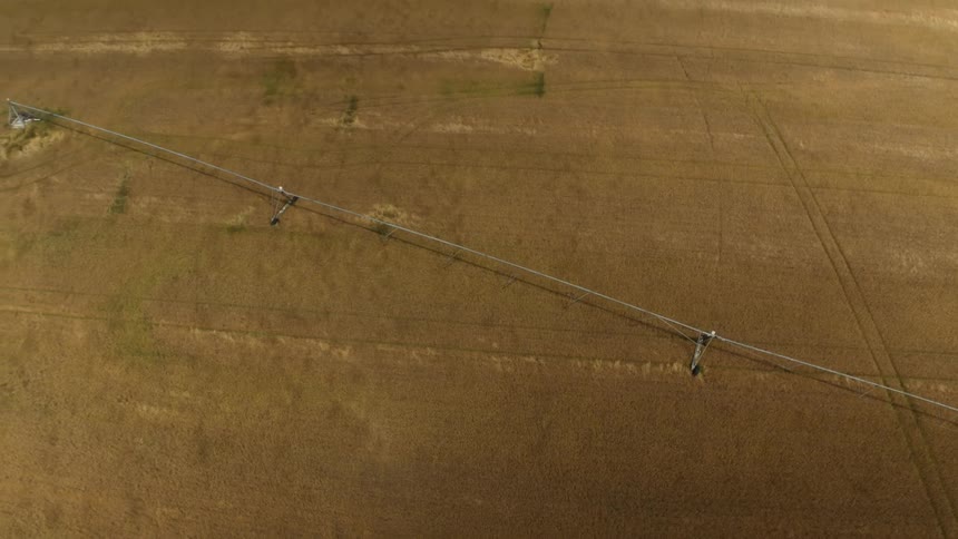 Large sprinkler waters vast area of farm crops