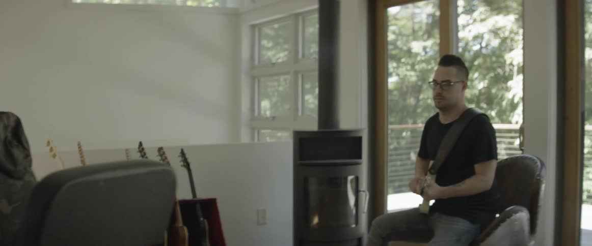 Two men collaborate in a music room