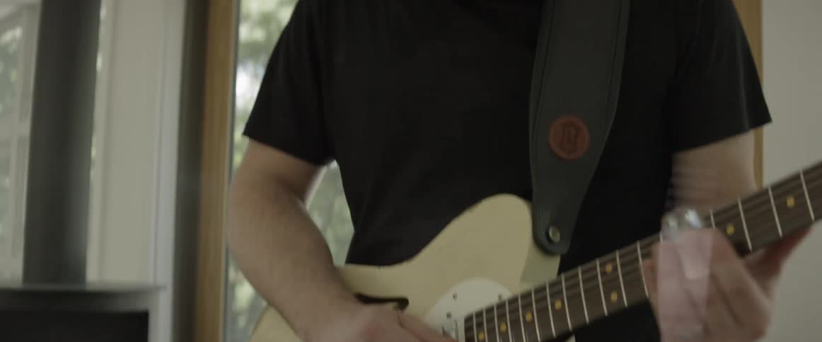 Man plays an electric guitar