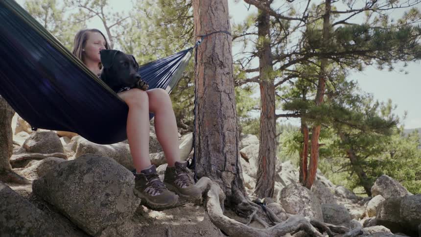 Woman Hammocking With Dog