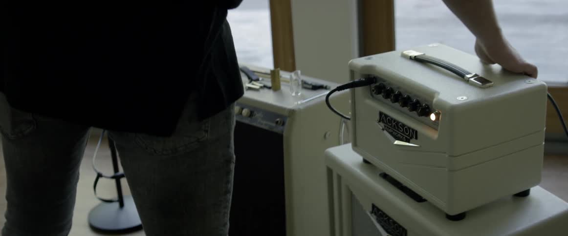 Man turns on sound equipment