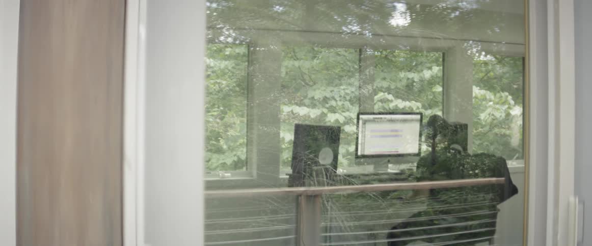 Man works on a computer at a desk
