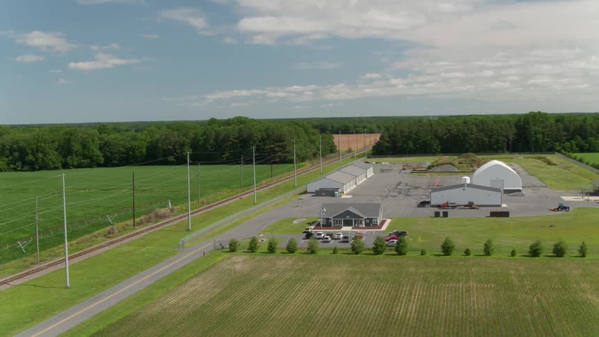 Buildings stand on a rural farm