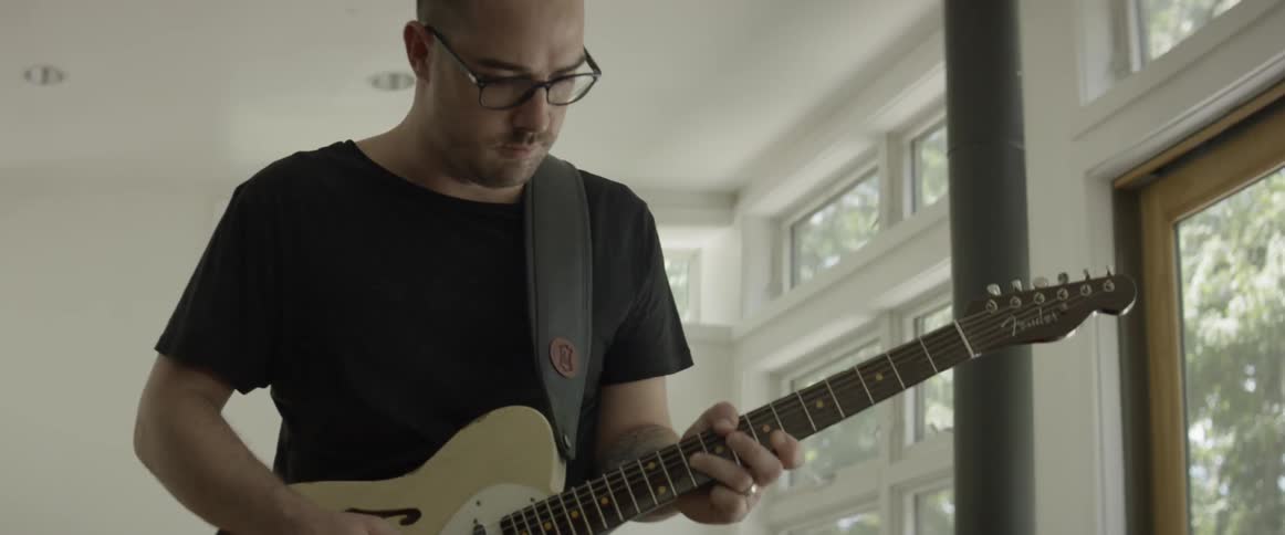 Man plays electric guitar