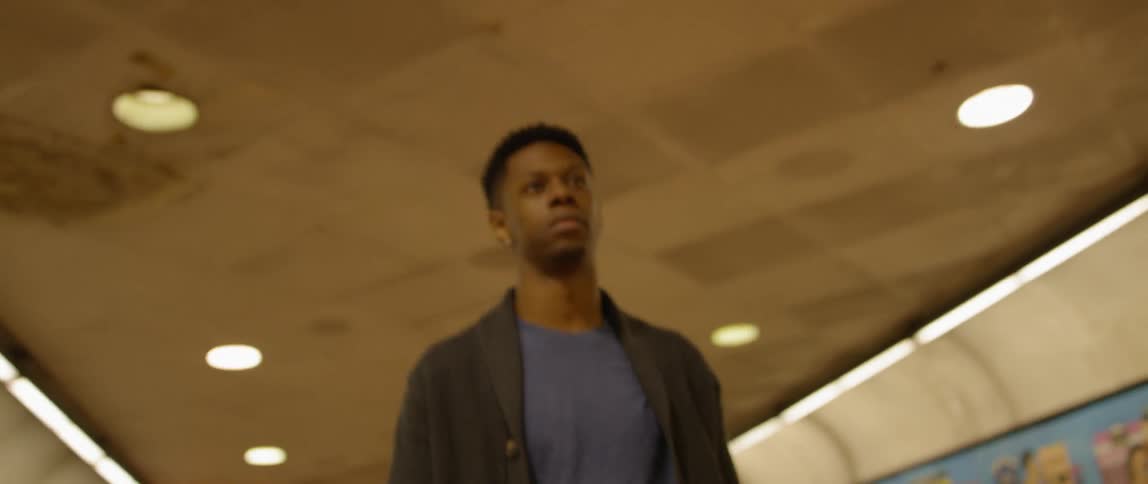 Man walks in an airport in the evening