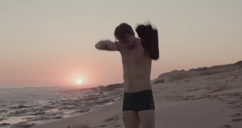 Man Exercising On The Beach