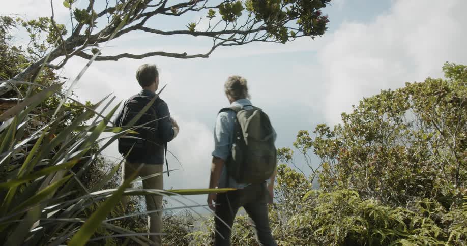 Two men stop to enjoy the view while hiking