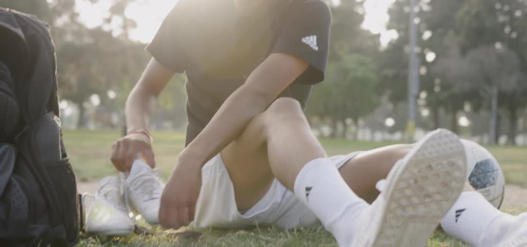 Teenage boy preparing to play soccer