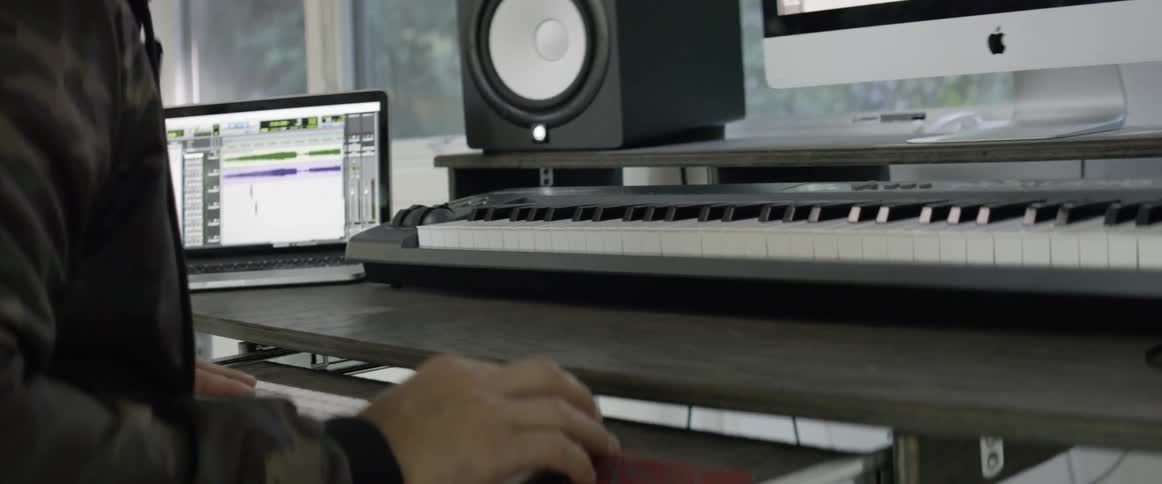 Person with keyboard and computer