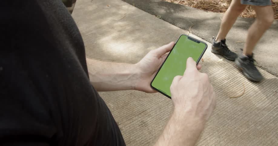 Man scrolls on a smartphone