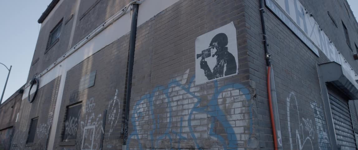 Graffiti covers a brick building