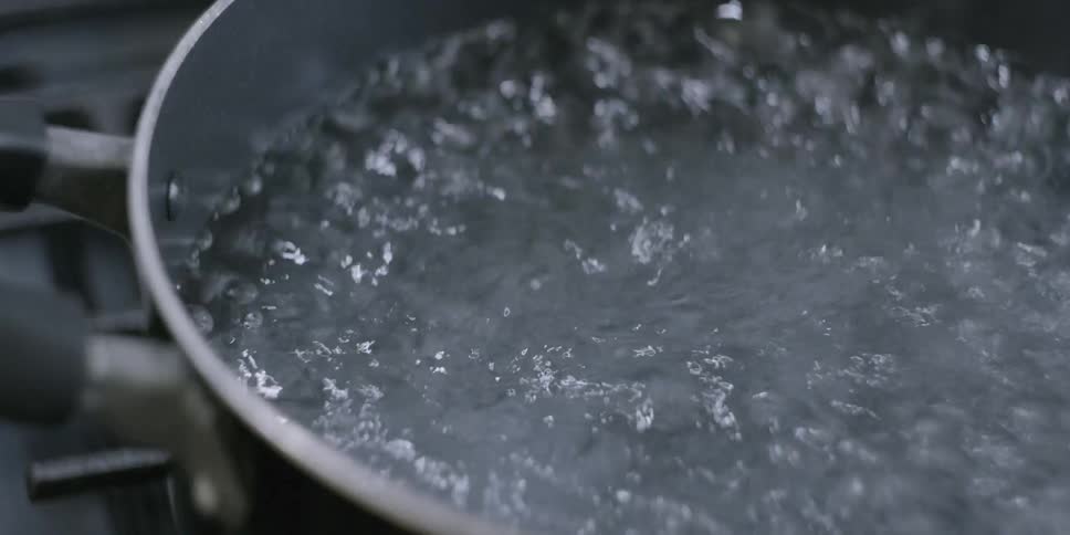 Water boils in a pot
