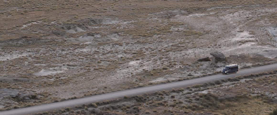 A van is driven on a rural road