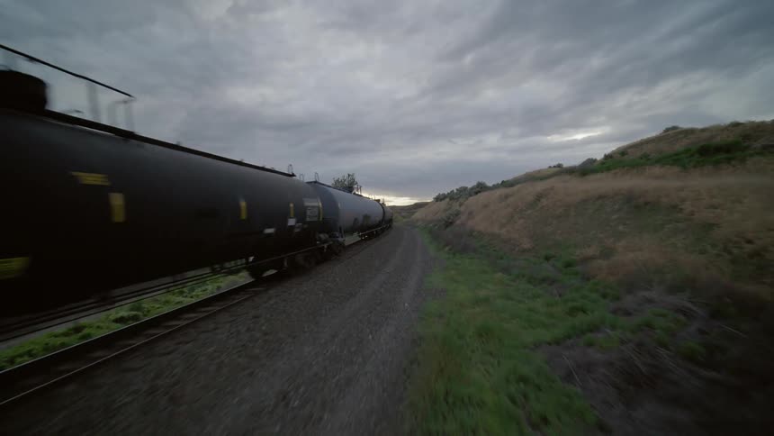 Converging alongside a fast moving freight train