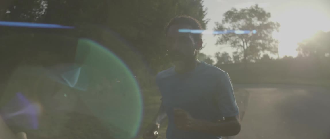 Man runs next to the trees