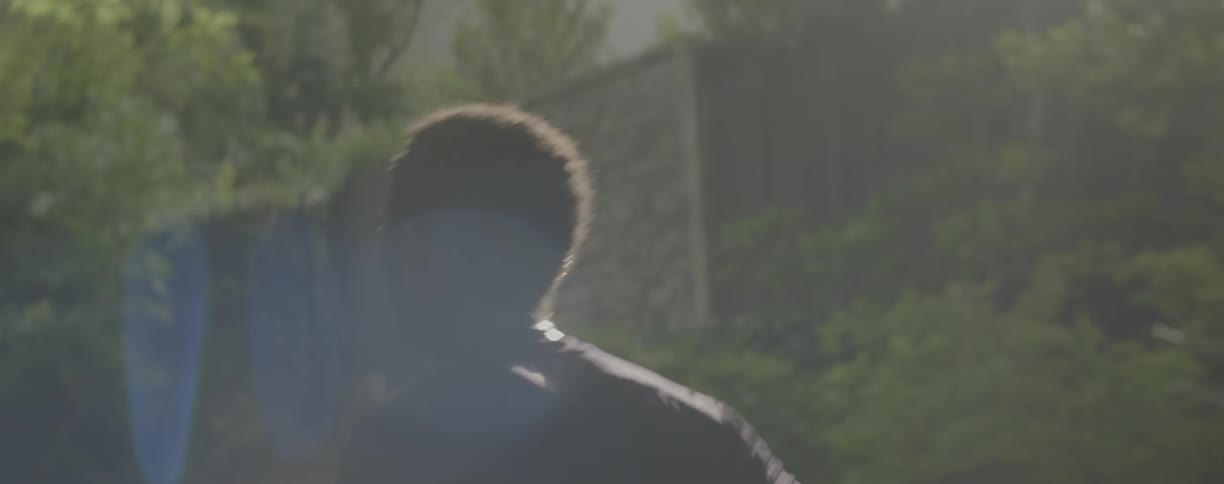 Man is jogging down neighborhood street