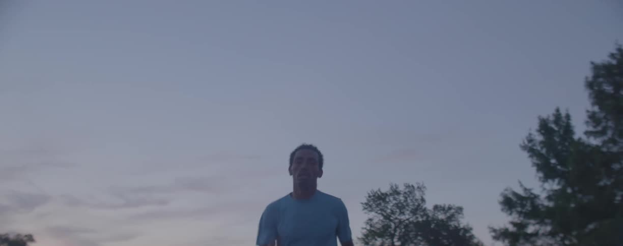 Man is jogging at dusk