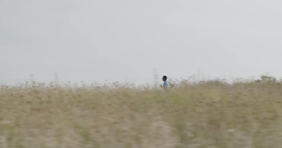 A man jogs on a rural road