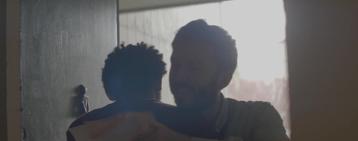 A man opens a door for his guest