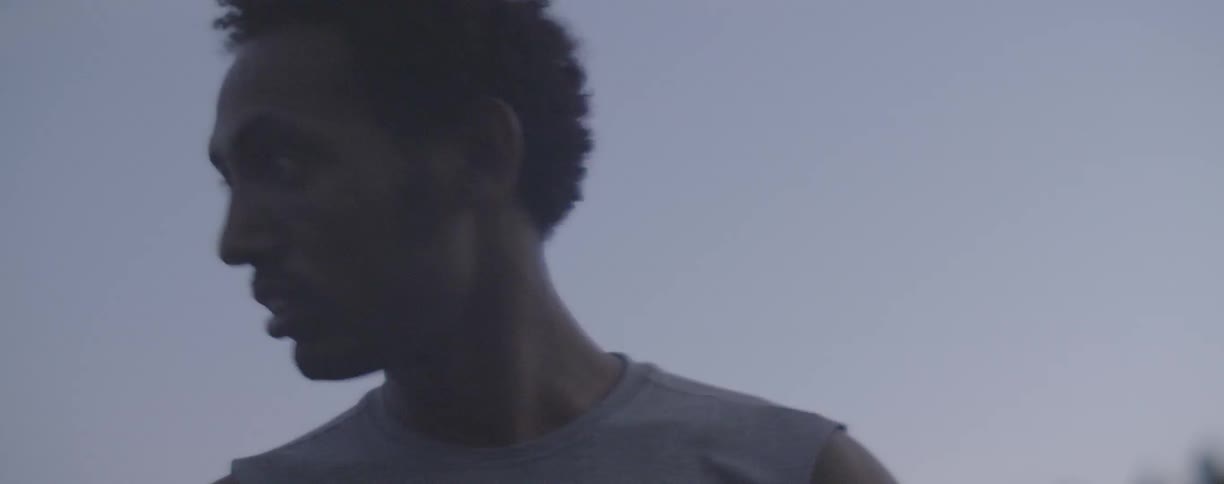 Man stands outside in a nike shirt