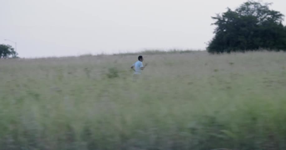 A man jogs on a rural path