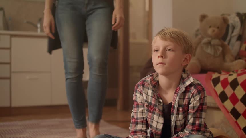 Young Boy Racing Next To Tv