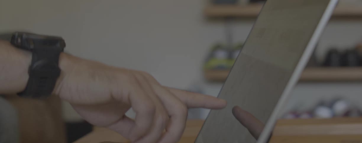 Man touches the touch screen of an electronic device