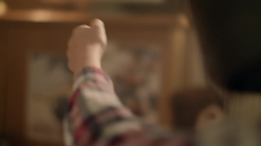 Young Boy Racing Next To Tv