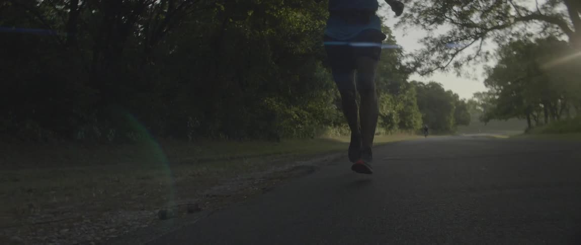 Man jogs along a path