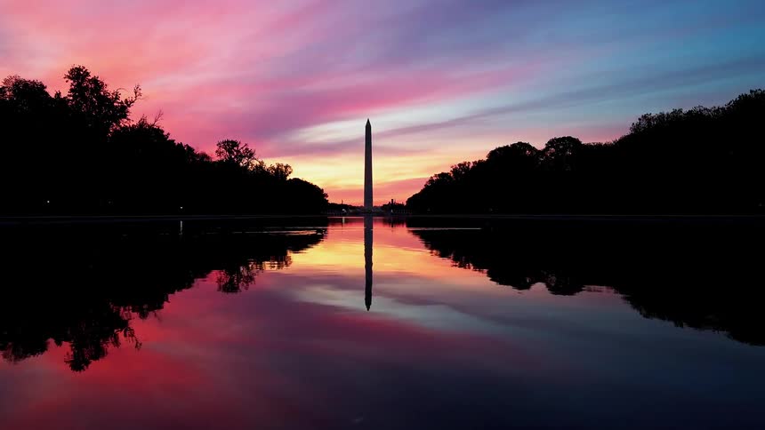Water rippling in front of washington monument after sunset