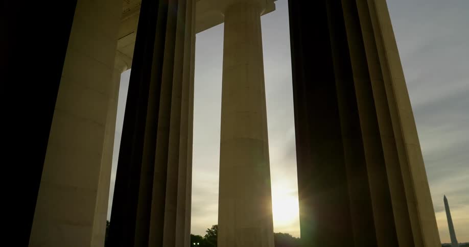 The sun sets over the national mall in washington dc