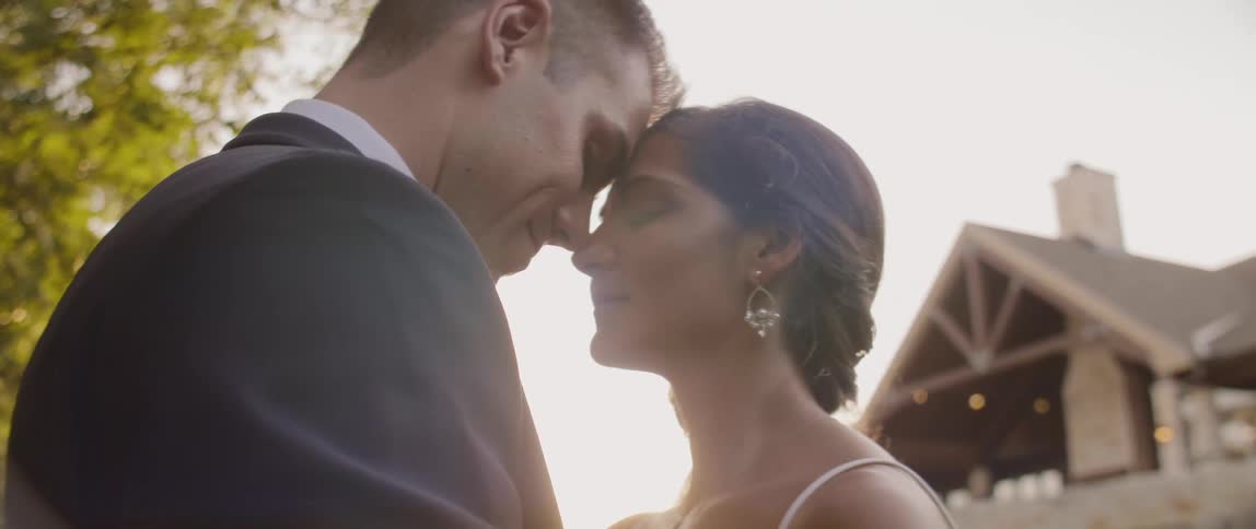 Bride and groom embrace