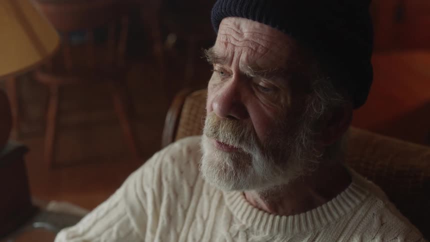 Elderly Man Living In Cabin