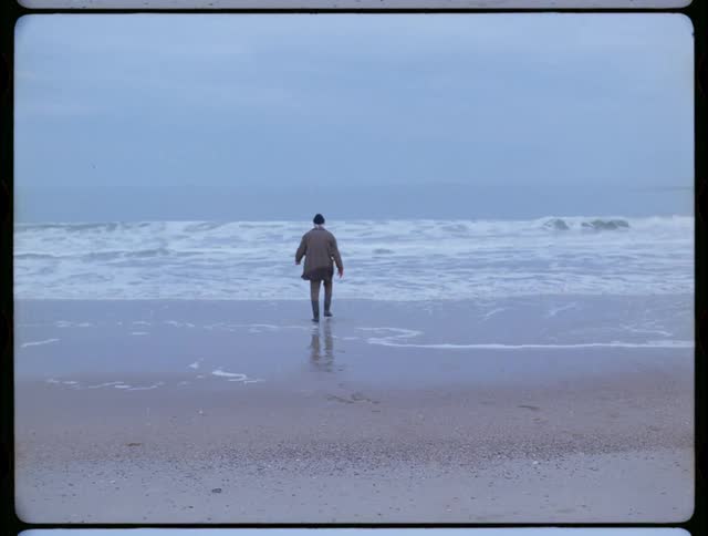 Man is walking out into the ocean