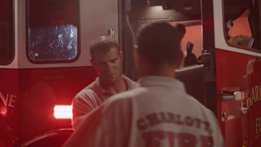 Firefighters climb out of fire truck