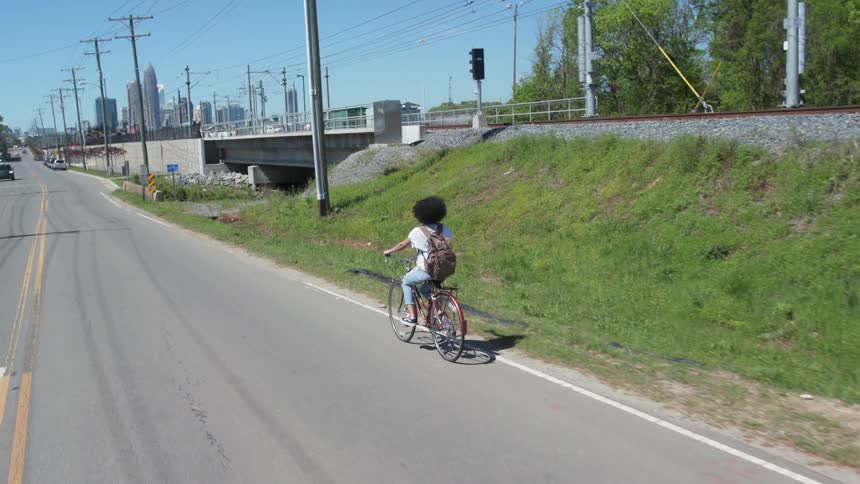 Child ride bike down street