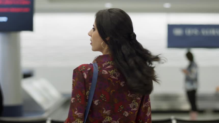 Woman looking around at airport