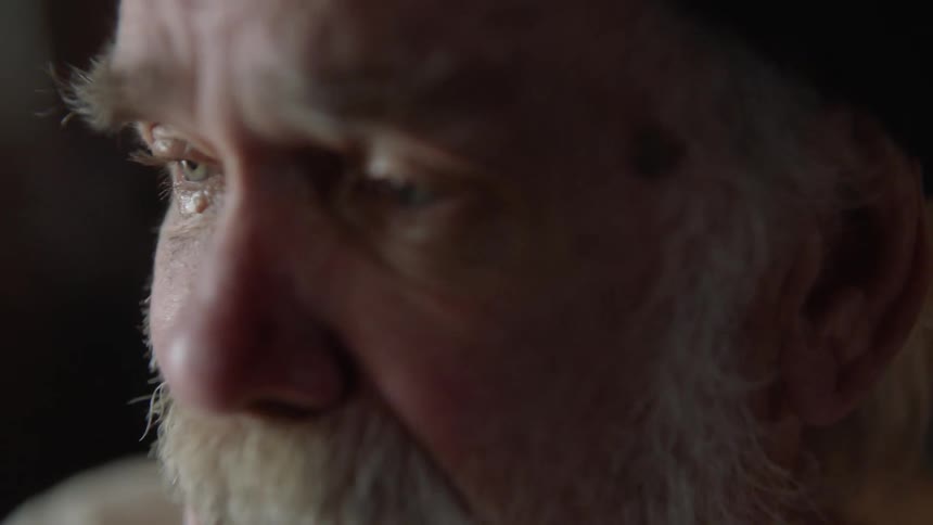 Elderly Man Living In Cabin